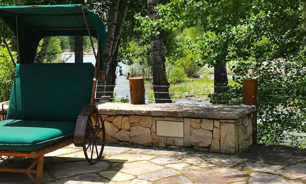 discreet rock speaker hiding among landscaping