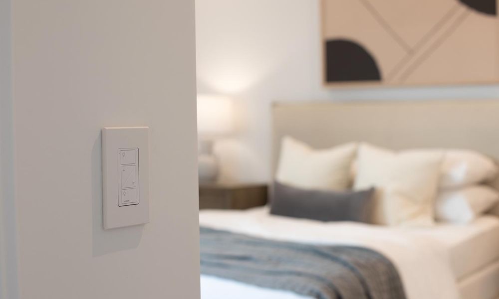 Minimalist light switch on wall near a bedroom