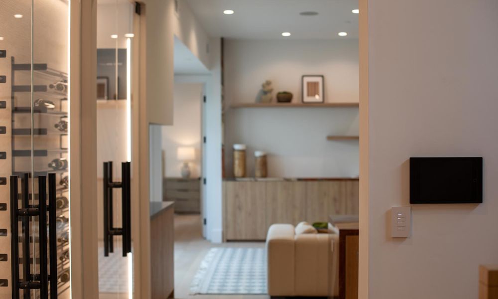 Wall-mounted control panel and tablet in a modern living room